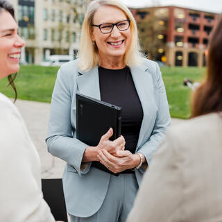 Three Ferguson Wellman Employees talking next to Portland Waterfront