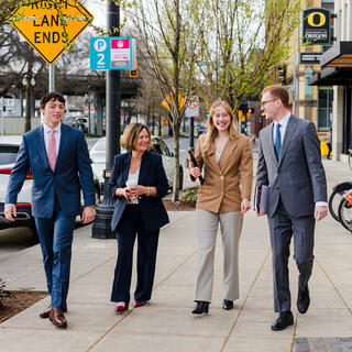 Four Ferguson Wellman Employees walking together outside