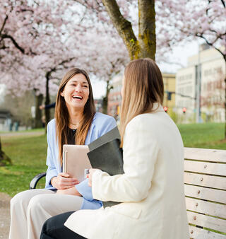 Two Ferguson Wellman employees talking downtown Portland by the waterfront