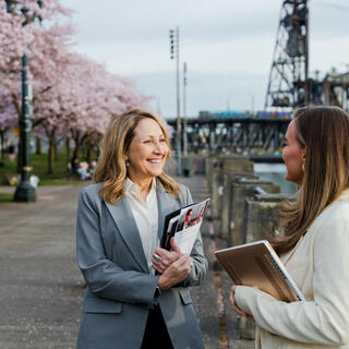 Two Ferguson Wellman employees talking downtown Portland by the waterfront