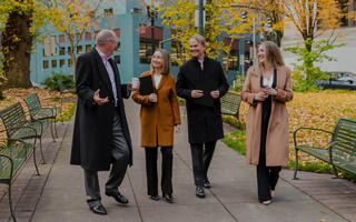 Four Ferguson Wellman Employees having a meeting outside in the autumn colors